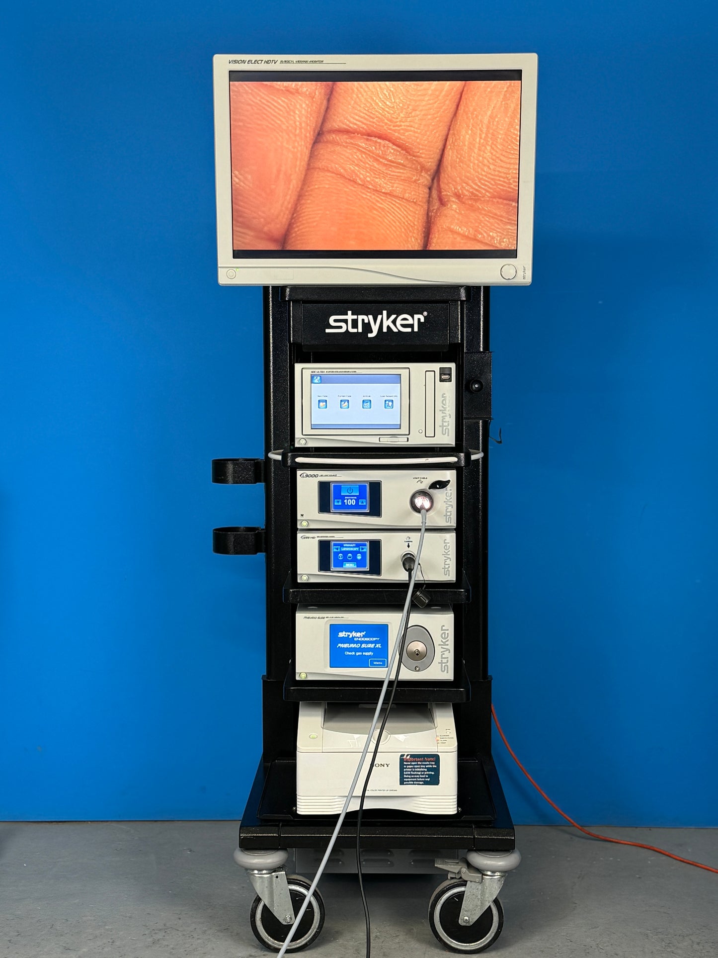 Stryker 1288 HD High Definition Camera Control Unit. Stryker 1288 HD Camera Head. Stryker L9000 LED Light Source. Stryker PNEUMO SURE XL High Flow Insufflator. Stryker SDC Ultra HD Information Management System Stryker Vision Elect HDTV Surgical Viewing Monitor 26'' Inch Stryker Trolley Printer