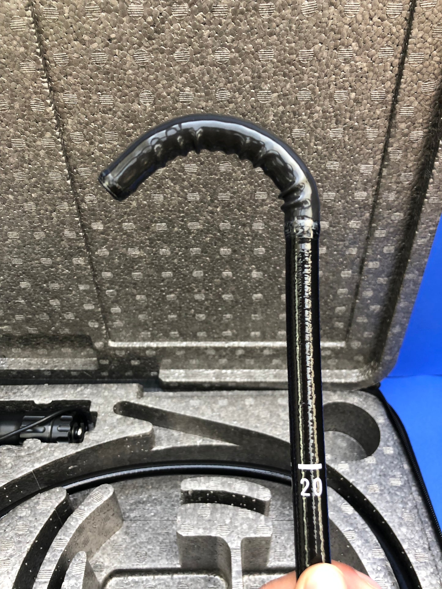 single-use distal end cap permits easier brushing access to the distal end of the endoscope