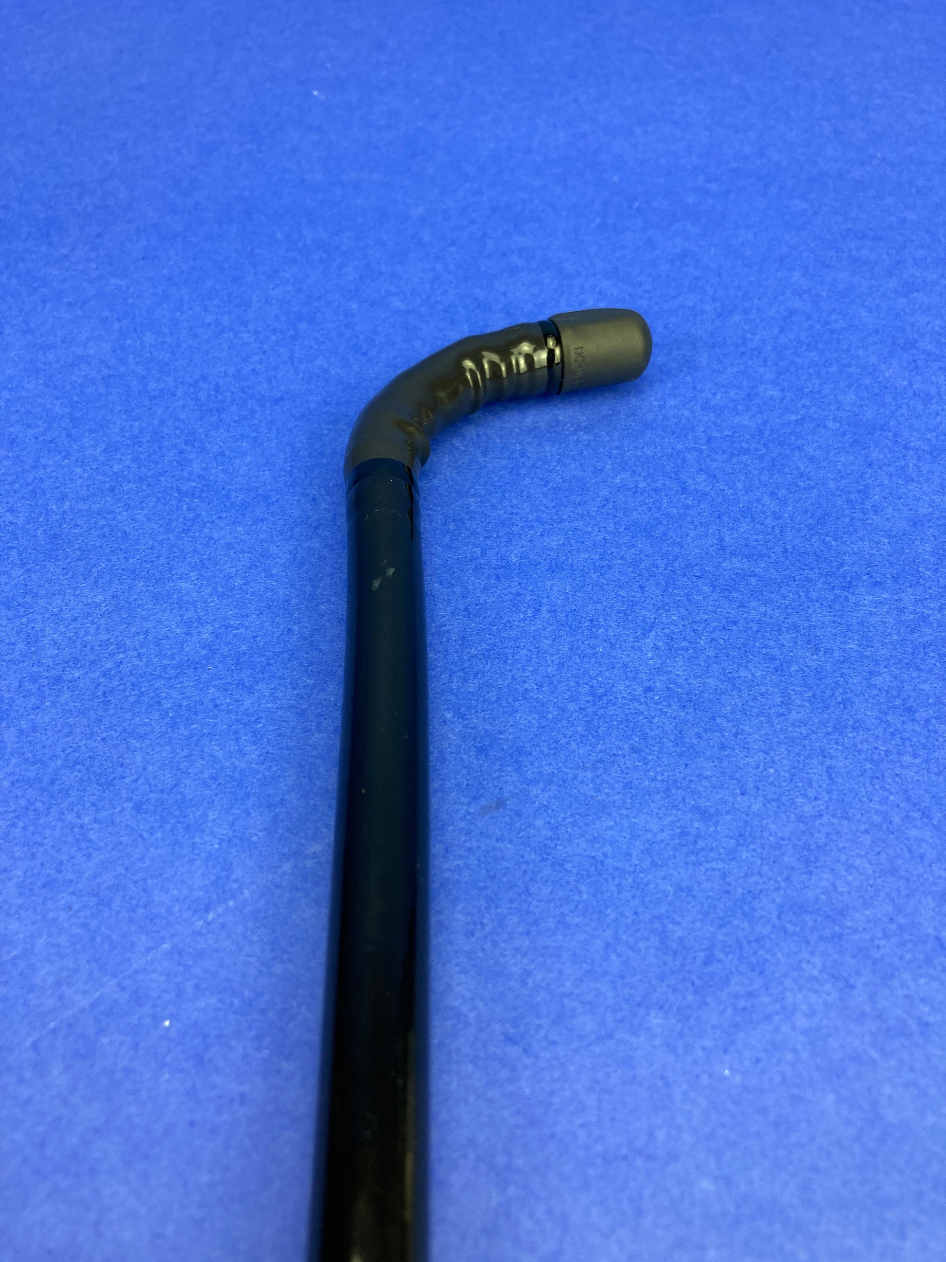 single-use distal end cap permits easier brushing access to the distal end of the endoscope